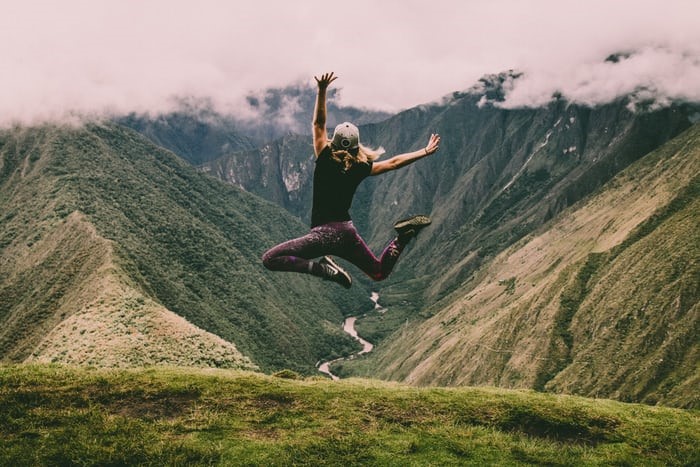 A woman jumping into the air