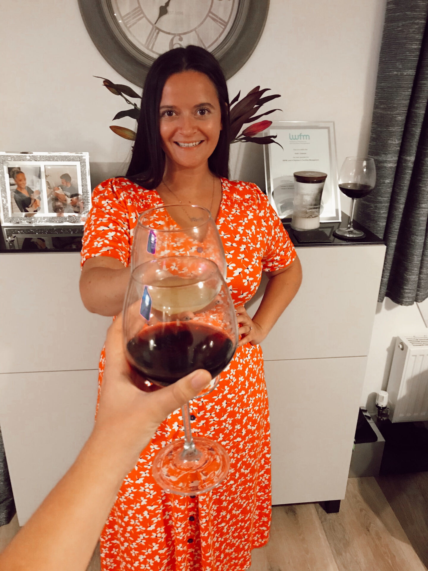 Woman cheers with red wine