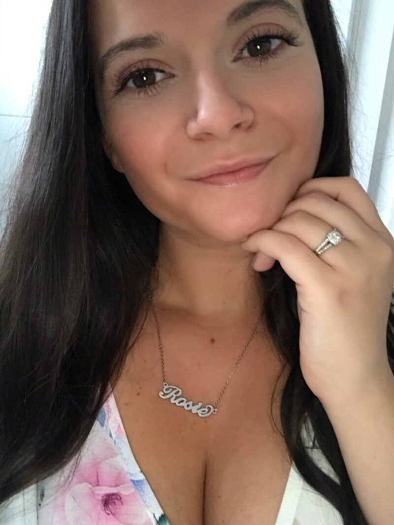 a female with brown hair smiles at the camera